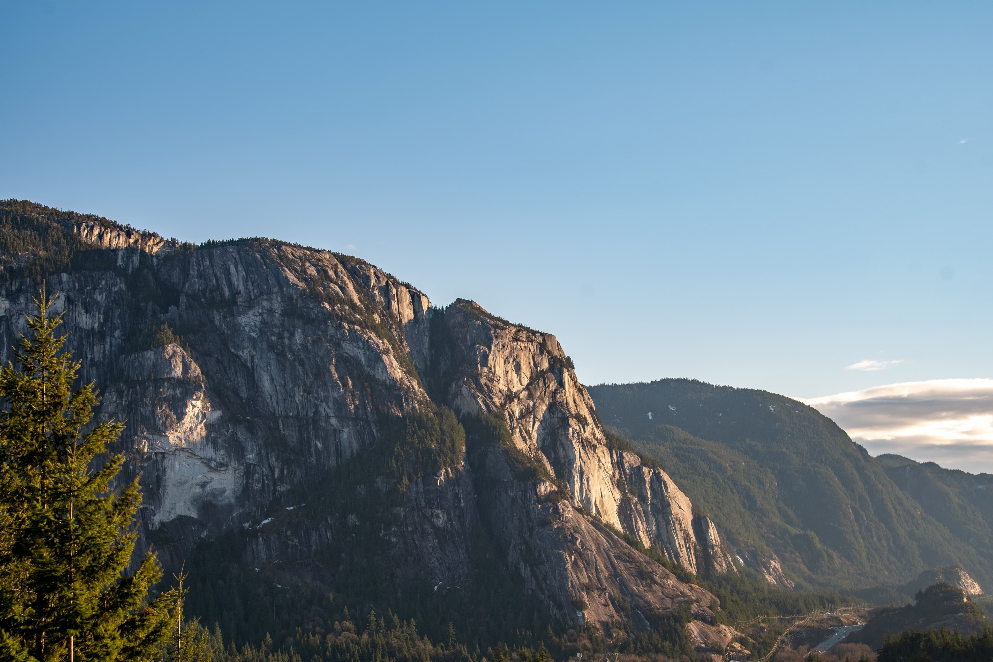 The Stawamus Chief granite cliffs above Squamish at golden hour in the Sea to Sky